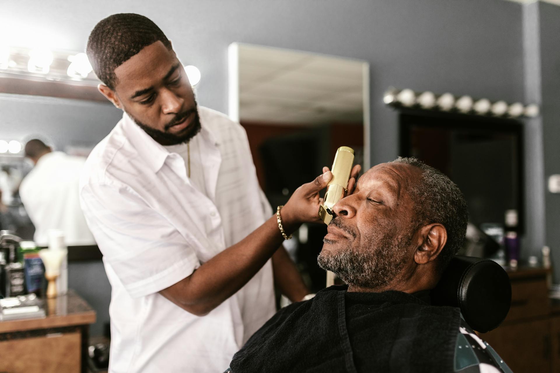 Signature fade haircut — close-up of clippers